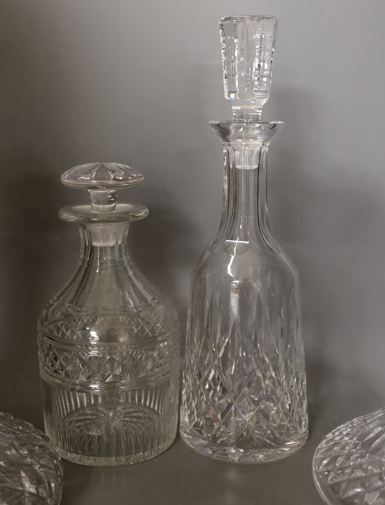 Two Waterford glass decanters, and three other decanters